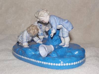 Anchor Mark Query - Boys Playing Marbles Figurine