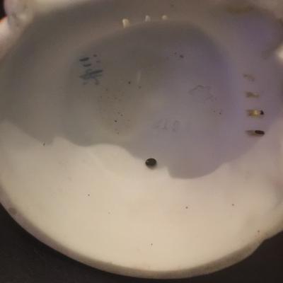 Brisque figurines unknown impression marks numbers and a star