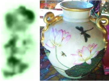 Crown over blurry green mark on snake handled vase Query