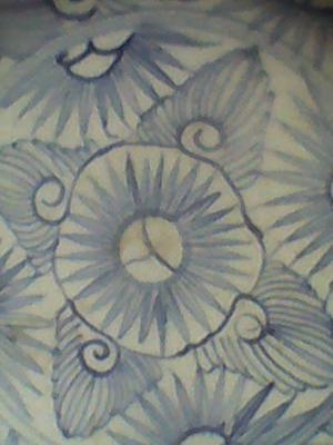 Hand painted geometric blue and white floral pattern on a bowl