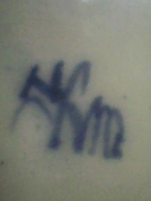 flowing kanji signature on the base