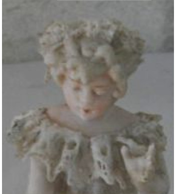 girl child figurine with unusual stick figure impressed mark