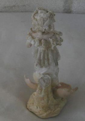 girl child figurine with unusual stick figure impressed mark