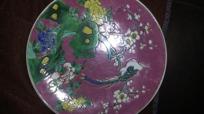 purple oriental plate with a pheasant, branches and lotus blossom foliage