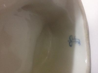 Porcelain figurine with a blue mark, crown over an H?