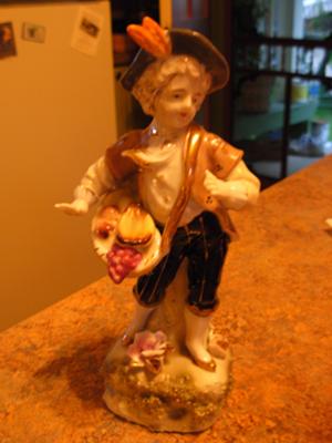 Male Figurine & Mark N with a C overtop