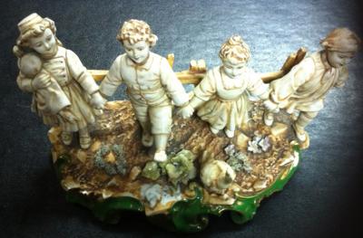Porcelain Mark Backtamp  on Figural Group of Skipping Children - Crown above shield with B (or Sv) over  Letter M