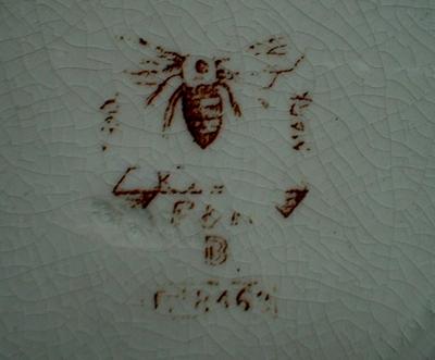 This is the backstamp - Bee with extended wings 