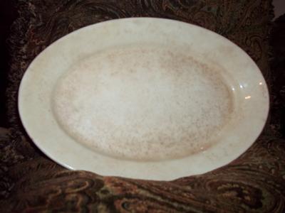 Serving Platter Makers Mark - Griffin and the initials under it TST