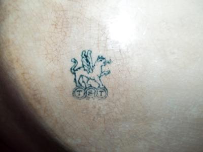 Serving Platter Makers Mark - Griffin and the initials under it TST