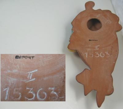 Terracotta Caribbean lady face wall plaque with pottery mark saying 'something... PORT'