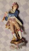 Male flute player dancing figurine