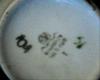 Close up of mark - Pottery Mark - crest within a circle, two wavy lines, W A L? 