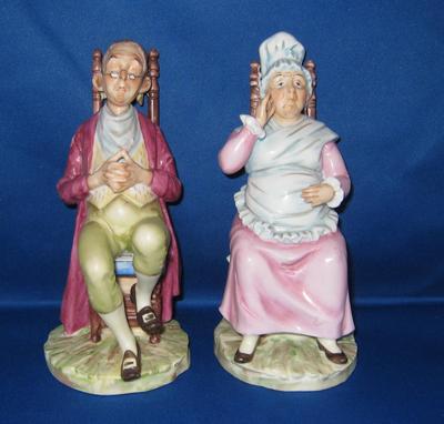 Two blue feathers mark of a pair of seated figurines, or possibly leaves conjoined at the stem