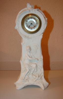 Two dots and FKJE or FYE or FTYE ? on a white porcelain clock