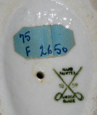 unidentified figurine pottery mark - crossed swords with oval hilts 'hand painted' and 1859