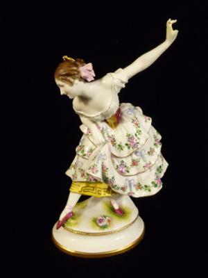 Curtseying German Figuine with arm aloft